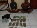 Dua pemuda bersama barang bukti ganja saat diamankan Polisi setelah ditangkap disekitar makam pahlawan Waena.( Foto. Humas Polda Papua)