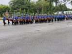 Penampilan Marching Band dari pelajar saat memeriahkan perayaan HUT PGRI ke-80 tahun 2025 Kabupaten Jayapura.